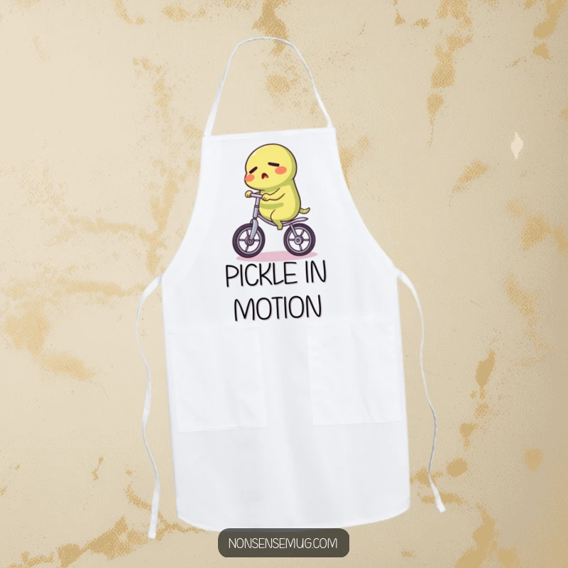 Funny Pickle Apron: A functional apron with a funny illustration of a determined pickle riding a unicycle, perfect for kitchen bravado.