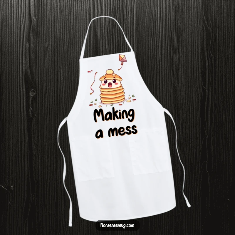Funny apron showcasing a surprised stack of pancakes hilariously trying to fly a kite, perfect for a humorous kitchen.