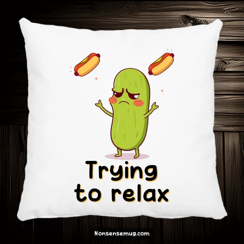 Funny pillow featuring a grumpy pickle looking confused while juggling three flying hot dogs, perfect for humorous comfort.