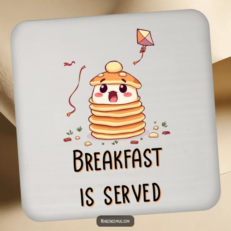 Funny coaster featuring a surprised pile of pancakes hilariously trying to fly a kite, adding breakfast charm.