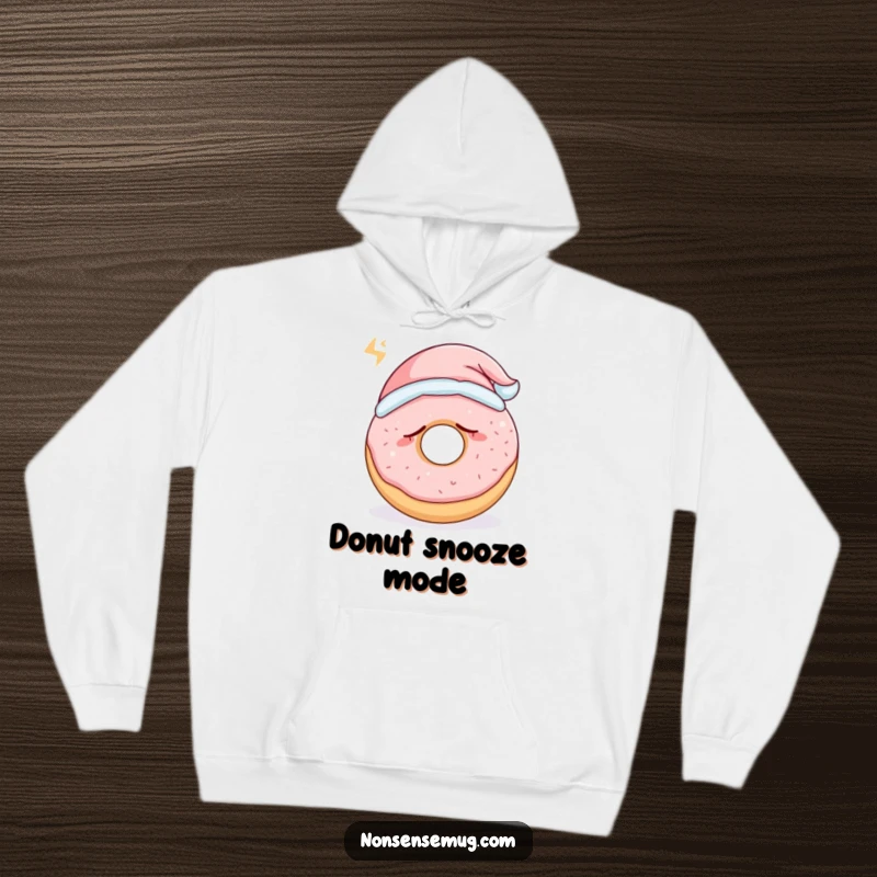 Funny sleepy donut wearing a tiny nightcap and snoring loudly, on a soft, warm hoodie, a perfect funny gift.