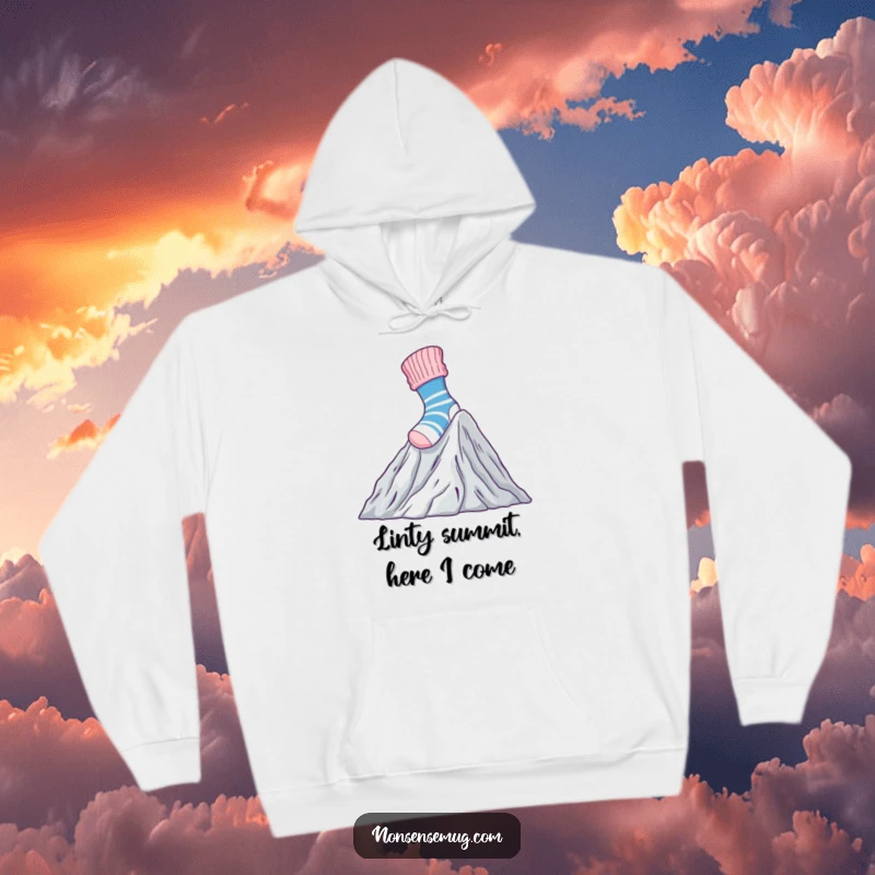 Funny Hoodie with a brave sock climbing a mountain of laundry, perfect for staying warm while conquering chores.