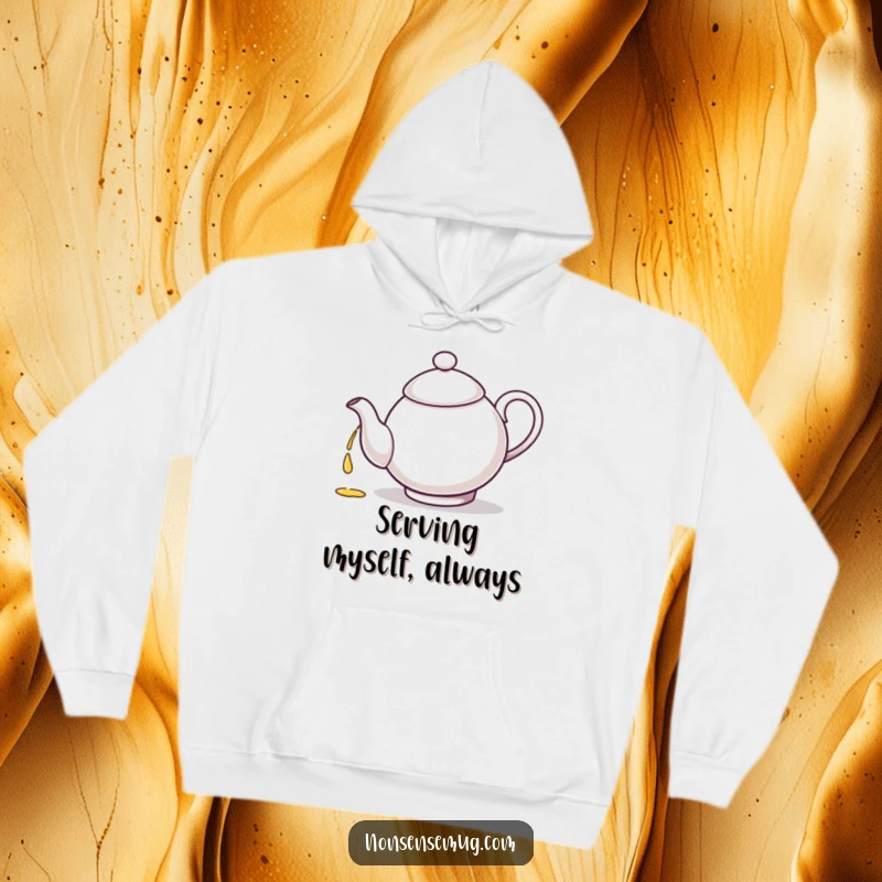 Funny, confused teapot character is depicted pouring tea into its own spout on a cozy hoodie.