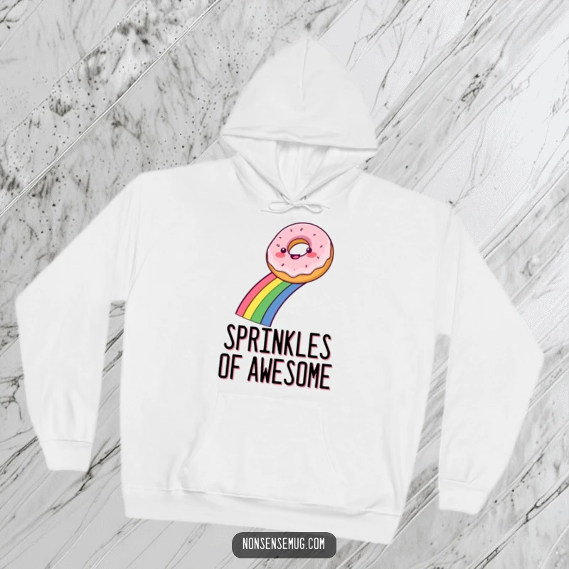 Funny hoodie featuring a delighted donut gracefully sliding down a bright rainbow, offering cozy and cheerful vibes.