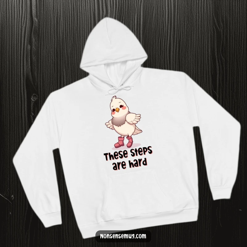 Funny pigeon wearing boots, trying to dance, printed on a warm hoodie, conveying a sense of cozy, comical struggle.