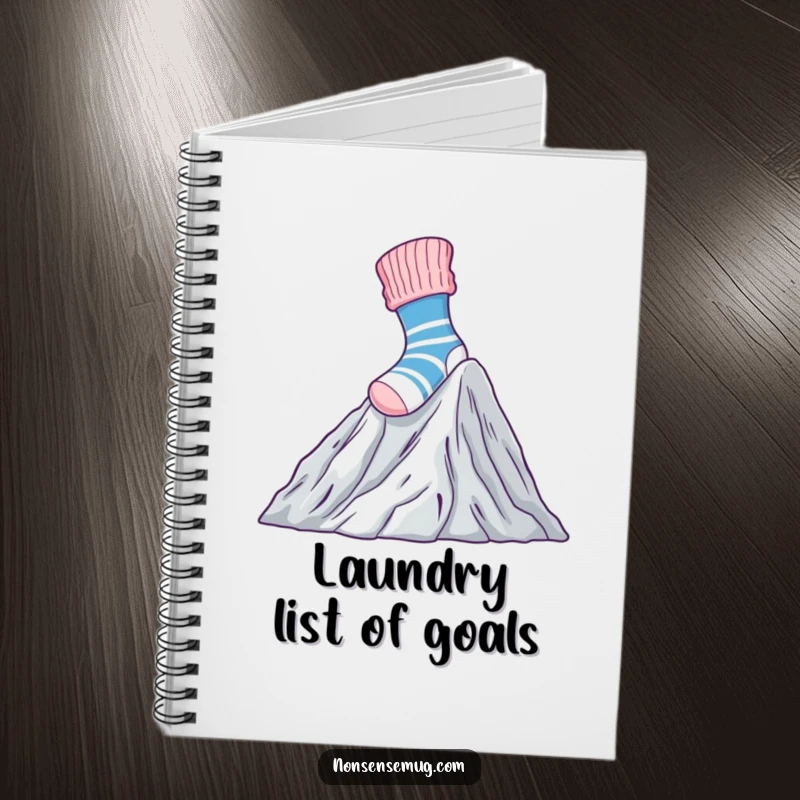Funny Notebook with a brave sock climbing Mount Laundry, perfect for journaling and note-taking.