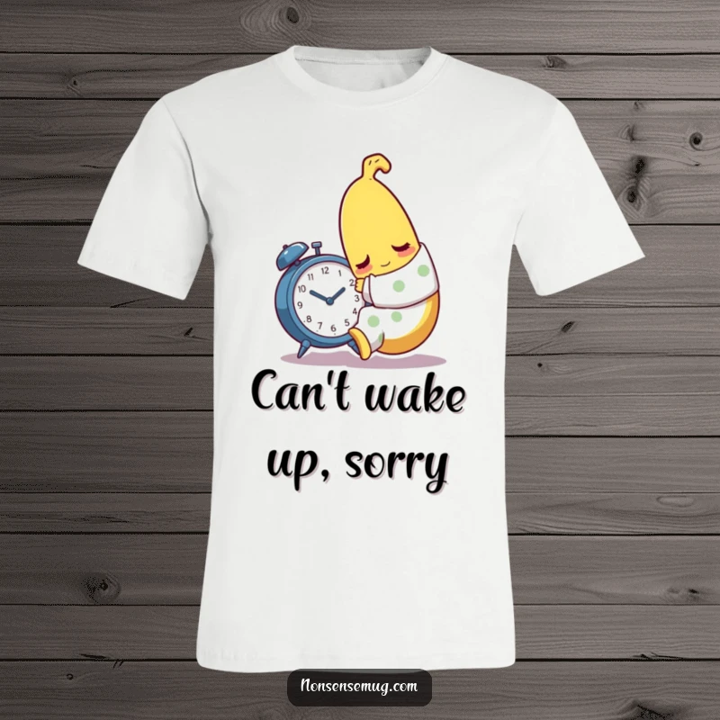 Funny sleepy banana character wearing pajamas, trying to embrace an alarm clock on a t-shirt.